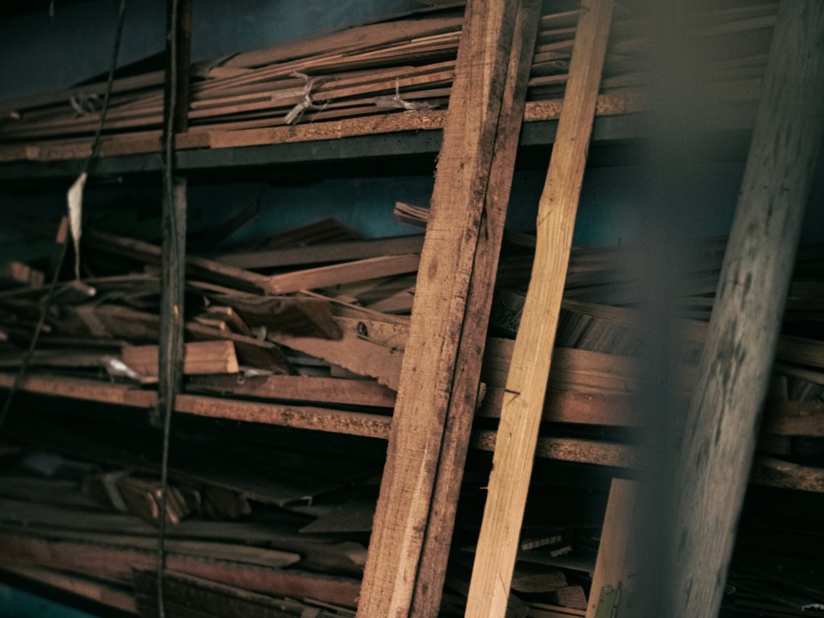 Timber stacked in a small workshop unit